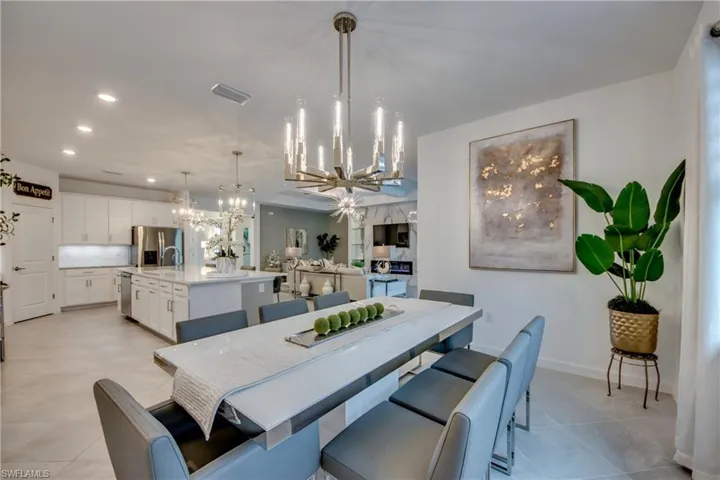 Dining room featuring a chandelier and light tile patterned floors