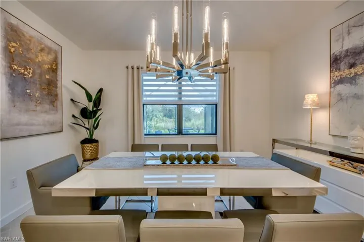 Dining room with a notable chandelier