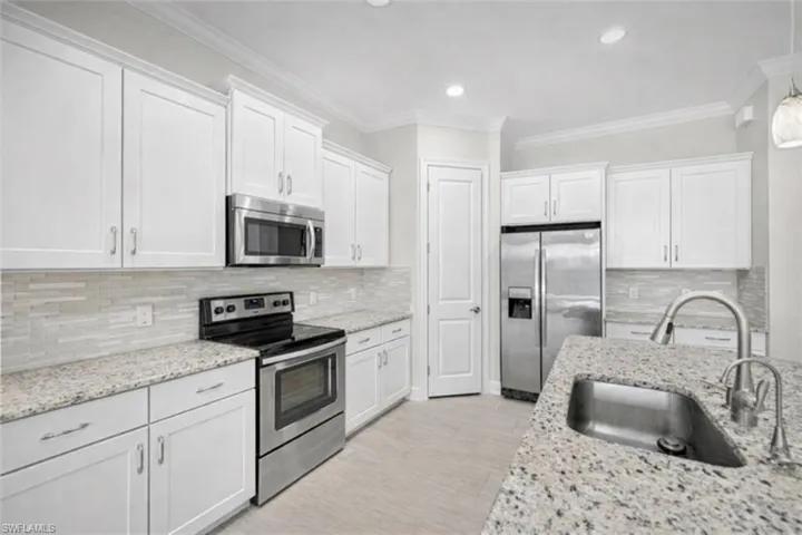 What the kitchen will look like if the cabinets are painted white.