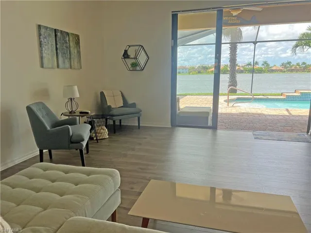 Sitting on the sectional and enjoying the pool and lake view