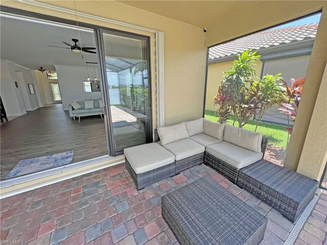 View of lanai featuring outdoor lounge area under roof