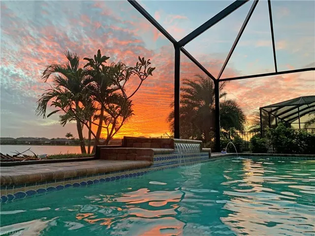 Pool at dusk with pool water feature on