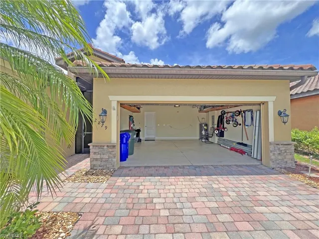 View of front house with garage open