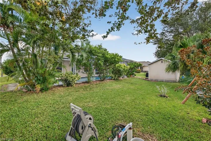 View of green lawn with a lanai
