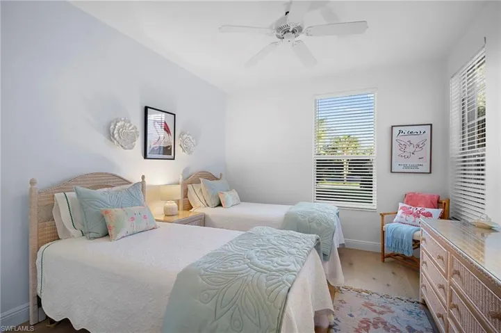 Bedroom featuring Mirage wood floors and ceiling fan