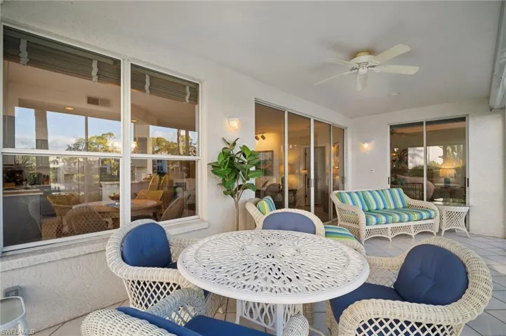 Sunroom with ceiling fan, outdoor dining area, an outdoor hangout area, and a patio