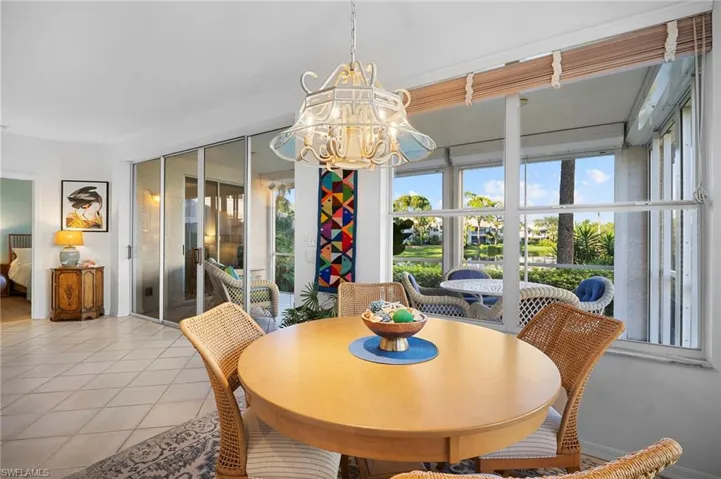Dining area featuring a chandelier and tile patterned floors