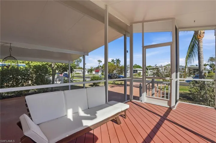 Unfurnished sunroom with a deck