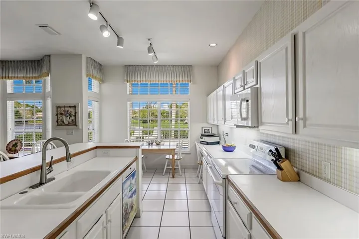 Kitchen with Views to Pool and Lake ... WOW