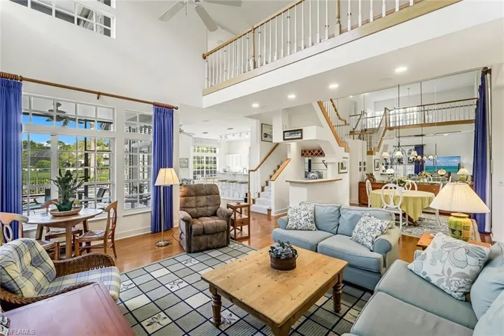 Wet bar, conversation area, living, dining and kitchen all with vaulted ceiling. Such a grand GREAT room!