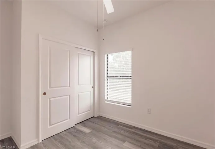 Room featuring light gray wood-finish flooring and white walls