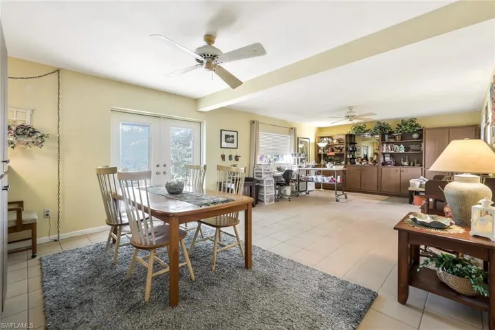 Dining room with plenty of natural light, a ceiling fan, and light tile patterned floors