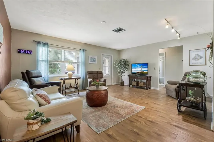 Living area with light wood finish floors