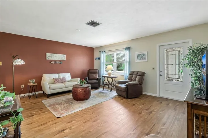 Living room featuring wood finish floors.