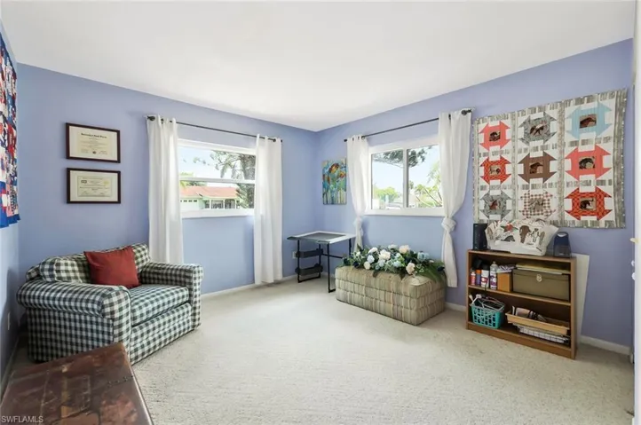 Bedroom with carpet  and plenty of natural light