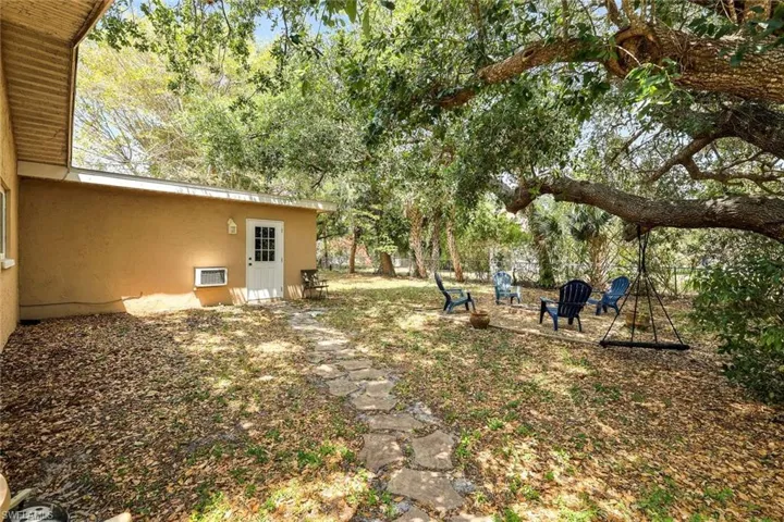 View of yard with a patio area, a fire pit, and fence private yard