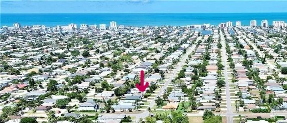 Aerial perspective of suburban area with a large body of water