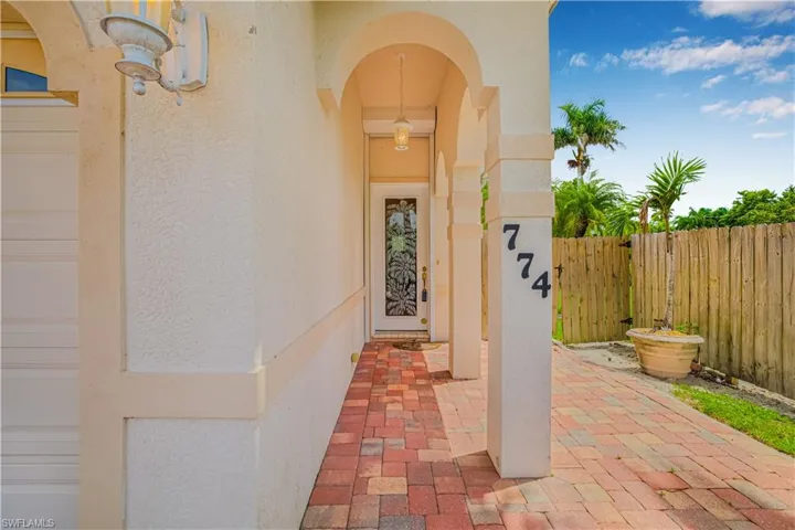 Entrance to property featuring stucco siding