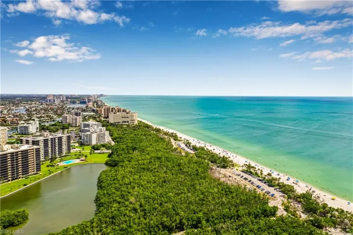 Drone / aerial view of waterfront with a beach