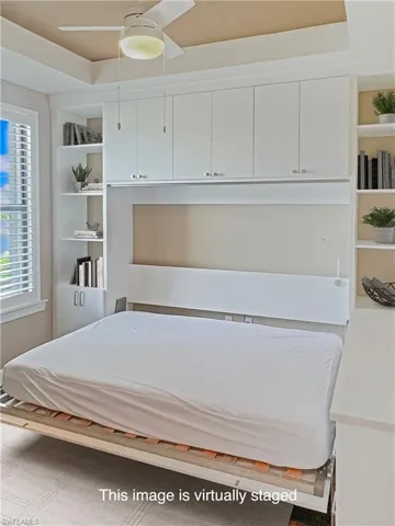 Showing the Queen size Murphy bed down in the den for a convertible 4th bedroom.