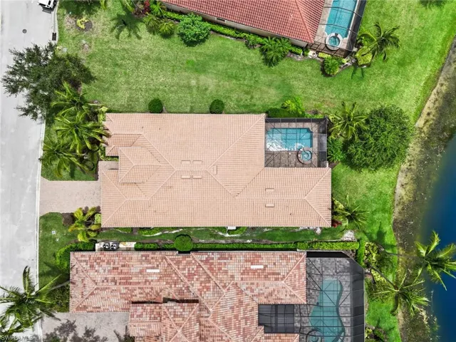 Aerial view of property and surrounding area with a pool