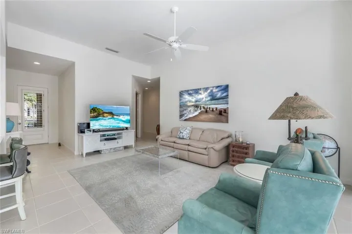 Tiled living room with ceiling fan
