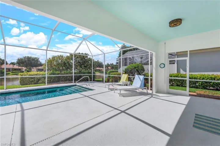View of pool featuring a patio and a lanai