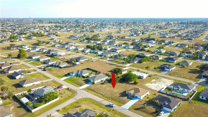Aerial overview of property's location with nearby suburban area