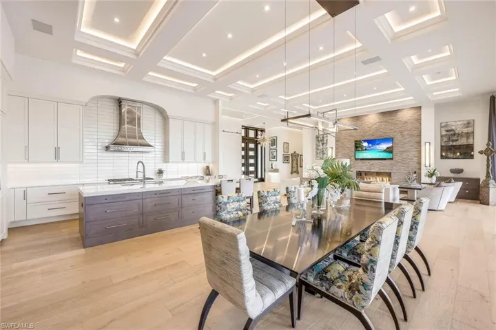 The dining area boasts a spacious layout, ideal for hosting large gatherings.