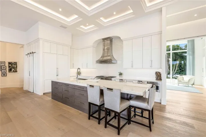 The kitchen is strategically designed to maximize both style and efficiency.