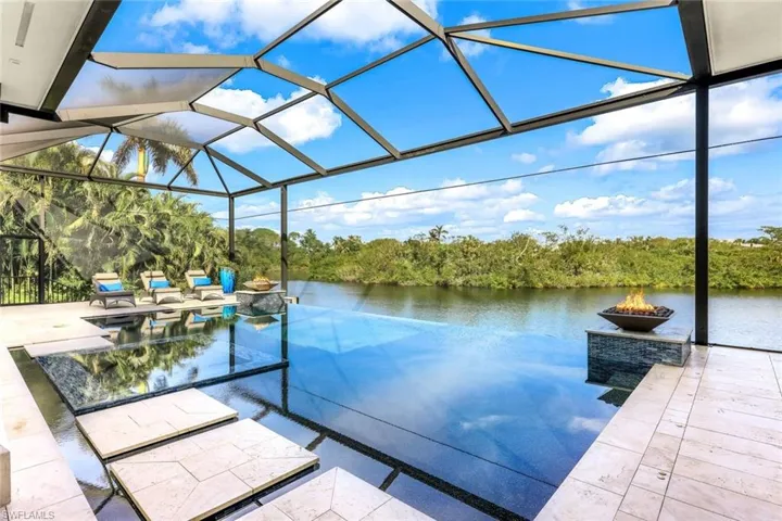 AMAZING home ON one of the most beautiful and unique lots in all of Bonita Bay!