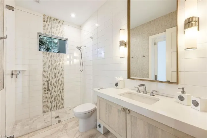 Guest bathroom with lanai access.