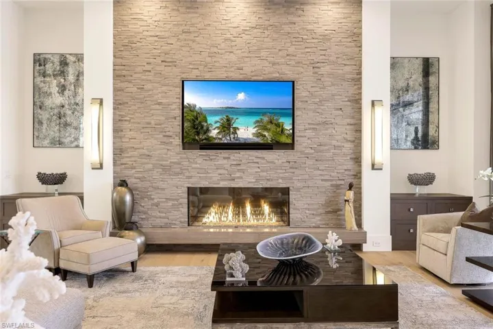 Striking custom fireplace serves as a focal point.