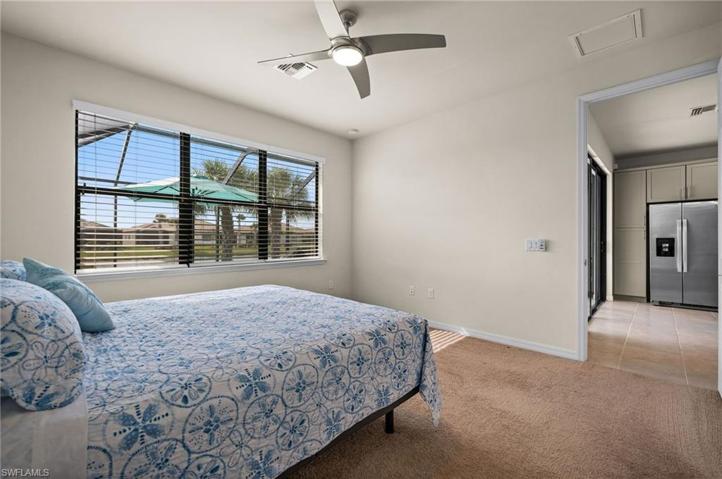 Primary/ Master Suite with a view of the pool