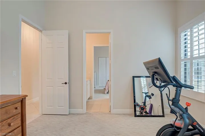 Bedroom #3 featuring light colored carpet