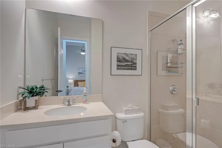 Ensuite bathroom with vanity and a shower stall