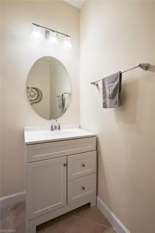 Bathroom with tile patterned flooring and vanity