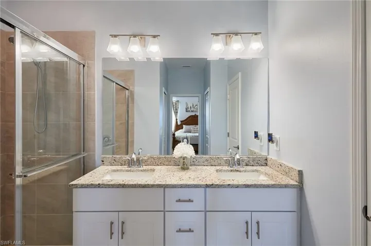 Bathroom with vanity and walk in shower