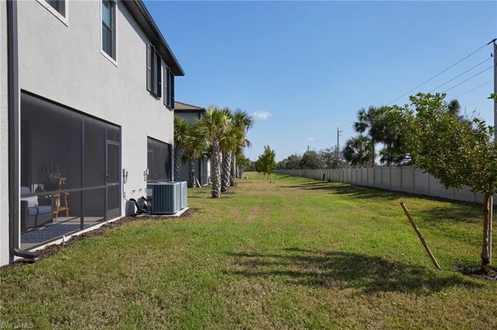 View of yard with central AC unit