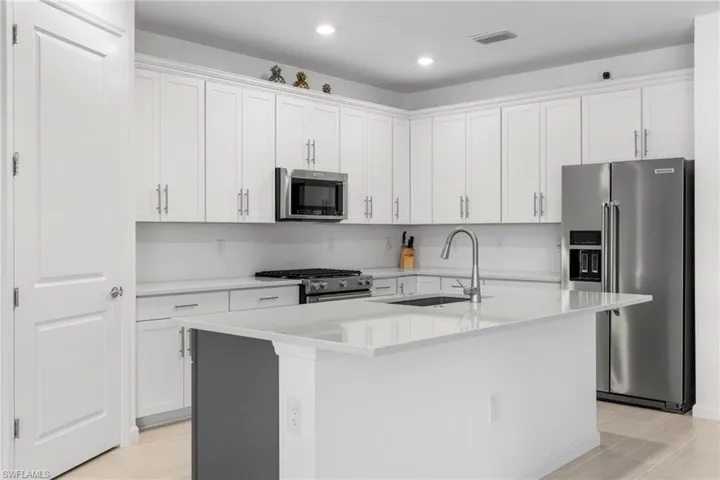 The kitchen has stainless appliances throughout along with a huge walk in pantry.