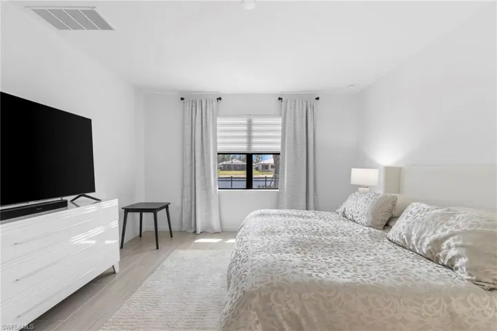 Master bedroom looks out over the lake.