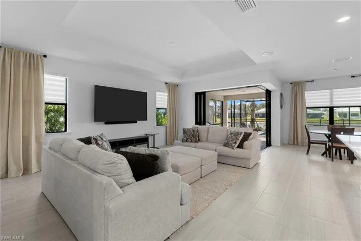 Beautiful living room layout and furniture along with zero corner sliding glass doors.