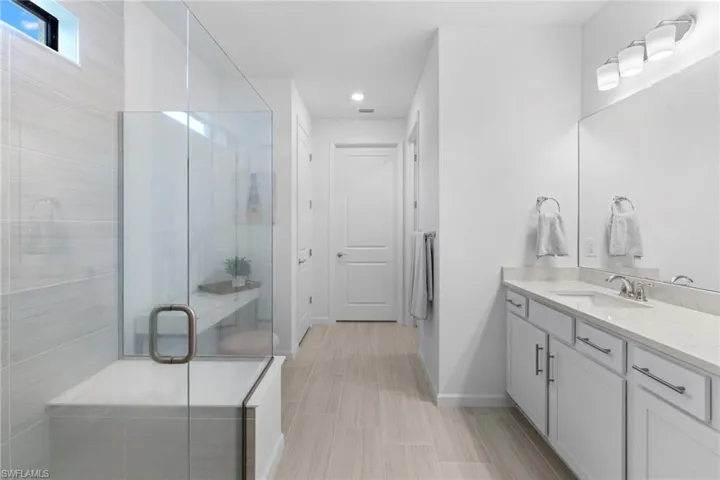 Owner's bathroom has a walk in spa like shower with double vanities and a huge walk in closet.