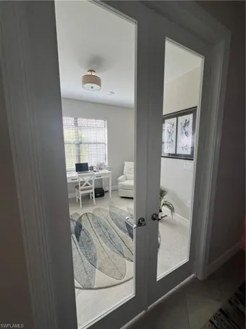 Detailed view of a desk and french doors