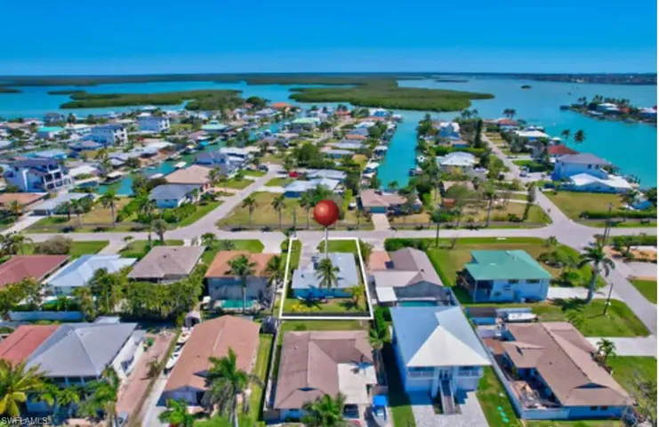Aerial view featuring a residential view and a water view