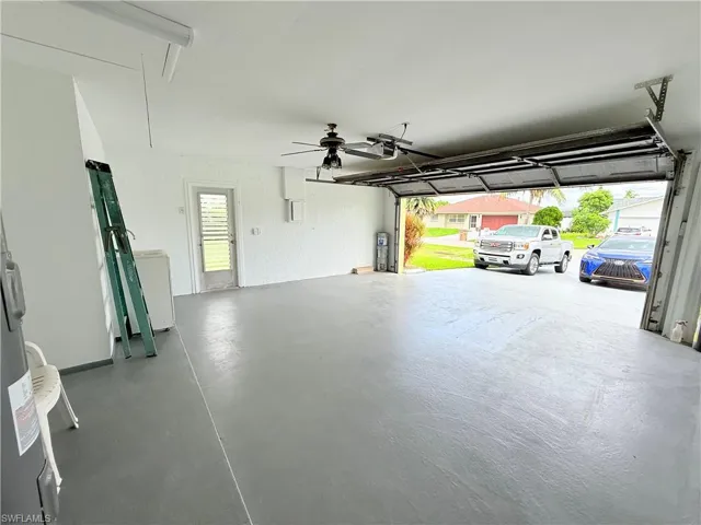 Garage featuring water heater