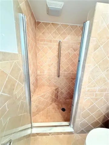 Bathroom with toilet and a shower stall