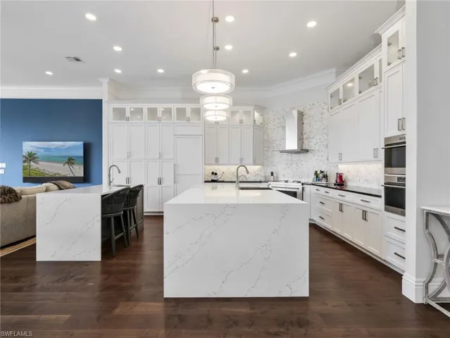 Plenty of lighted custom cabinets with soft drawer feature