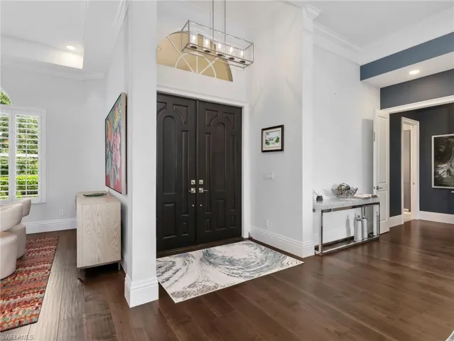 Grand Entry Way with dark solid doors