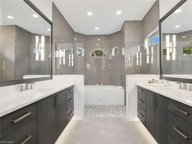 First Glass MB ensuite with is built in tub, dual shower heads and opposite dual sinks, everyone has their own space .